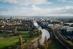 aerial shot of a river flowing through a city